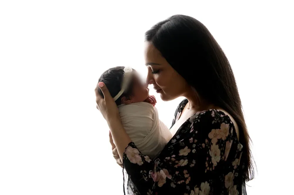 Dr. Nidhi nose to nose with her newborn