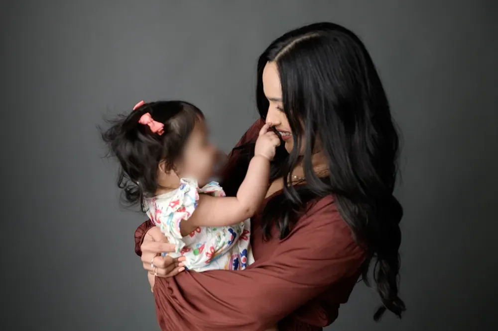 Dr. Nidhi laughing with her daughter