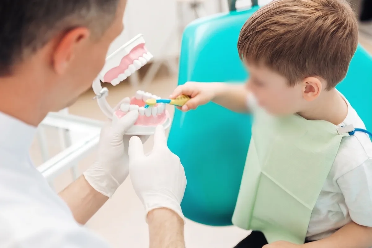 Dr. Nidhi treating a child in the dental chair